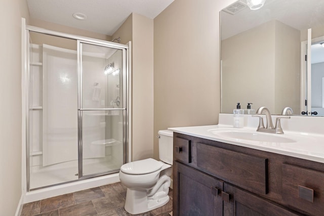 5175 White Star Ln, Woodbury, MN 55129 - bathroom featuring toilet, a stall shower, and vanity