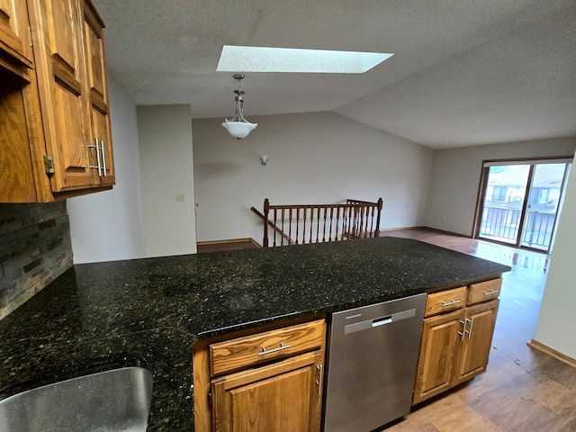 11173 Edgewood Cir N, Champlin, MN 55316 - kitchen featuring dishwasher, a skylight, light wood-type flooring, brown cabinetry, and vaulted ceiling