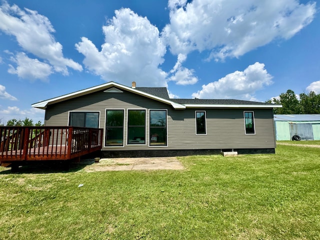 31083 County Road 4, Badger, MN 56714 - rear view of property featuring a deck and a yard