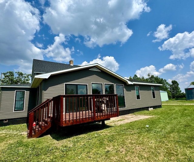 31083 County Road 4, Badger, MN 56714 - rear view of house with a deck and a lawn