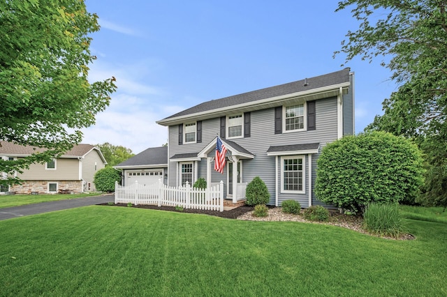 4142 Joppa Cir, Savage, MN 55378 - view of front facade featuring a front lawn, a garage, and driveway