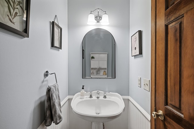 4142 Joppa Cir, Savage, MN 55378 - bathroom featuring a sink and a wainscoted wall
