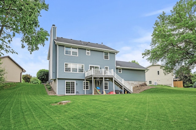 4142 Joppa Cir, Savage, MN 55378 - rear view of property featuring stairway, a wooden deck, a chimney, and a lawn