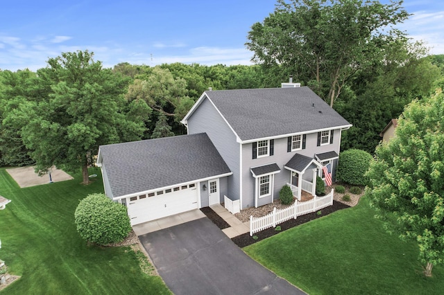 4142 Joppa Cir, Savage, MN 55378 - view of front facade featuring asphalt driveway, a shingled roof, a front lawn, and an attached garage