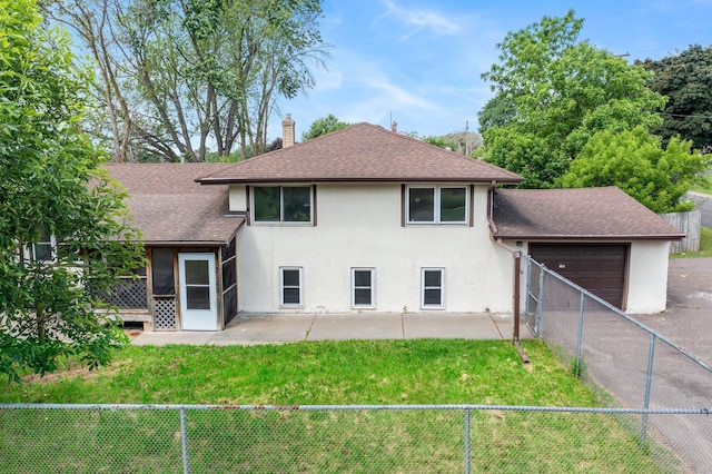 2125 White Bear Ave N, Maplewood, MN 55109 - rear view of house with roof with shingles, a chimney, a garage, stucco siding, and a patio area