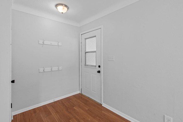 2125 White Bear Ave N, Maplewood, MN 55109 - doorway with dark wood finished floors and baseboards