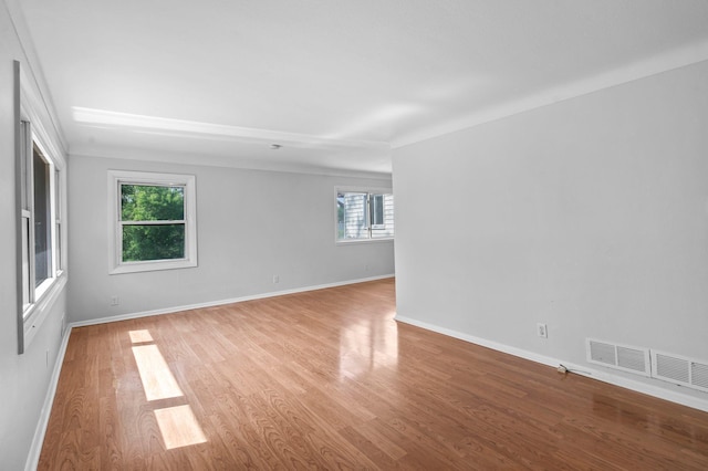 2125 White Bear Ave N, Maplewood, MN 55109 - unfurnished room with wood finished floors and baseboards