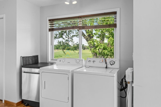 2125 White Bear Ave N, Maplewood, MN 55109 - laundry room with separate washer and dryer and wood finished floors