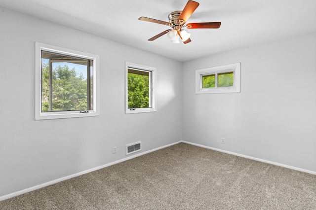 2125 White Bear Ave N, Maplewood, MN 55109 - carpeted spare room with baseboards and ceiling fan
