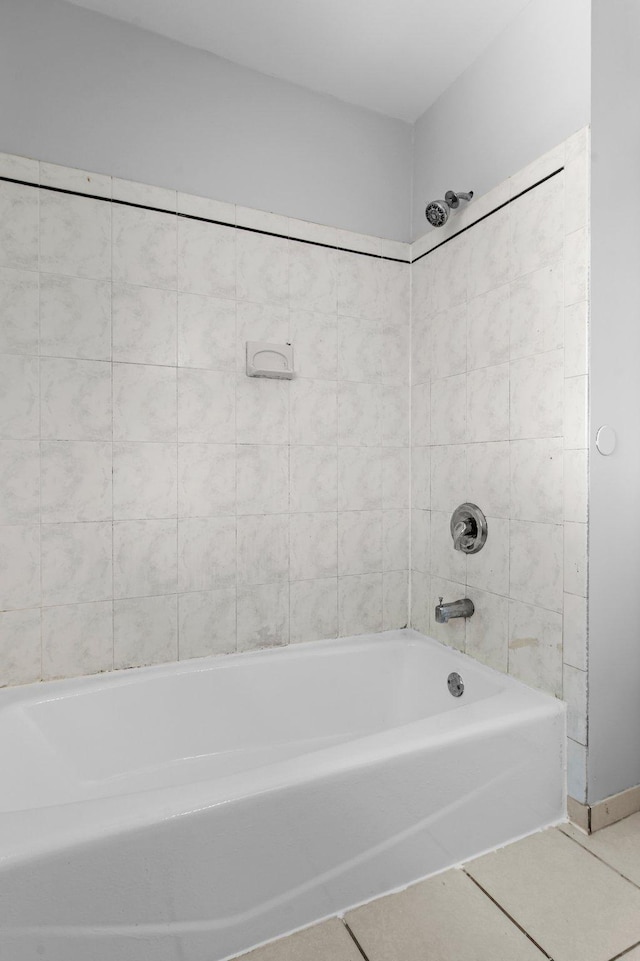 2125 White Bear Ave N, Maplewood, MN 55109 - bathroom with tile patterned floors, baseboards, and tub / shower combination