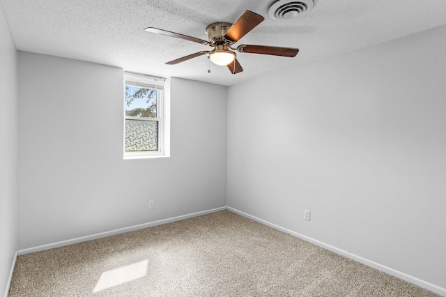 2125 White Bear Ave N, Maplewood, MN 55109 - carpeted spare room featuring a ceiling fan, baseboards, and a textured ceiling