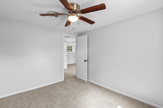 2125 White Bear Ave N, Maplewood, MN 55109 - spare room featuring light carpet, a ceiling fan, and baseboards