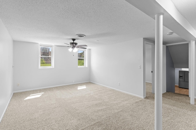 2125 White Bear Ave N, Maplewood, MN 55109 - empty room with light colored carpet, a ceiling fan, a textured ceiling, and baseboards