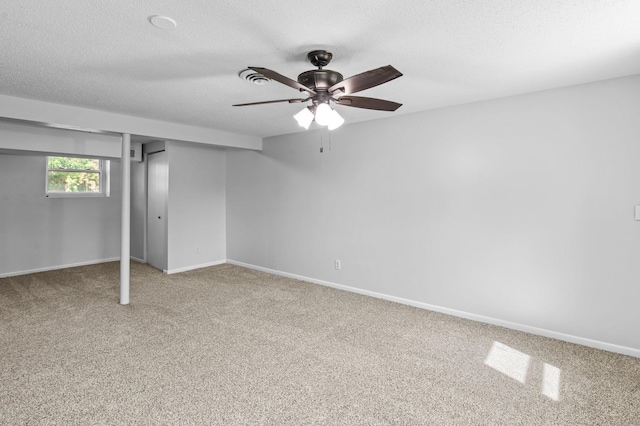 2125 White Bear Ave N, Maplewood, MN 55109 - unfurnished bedroom featuring light colored carpet, a closet, baseboards, a textured ceiling, and a ceiling fan
