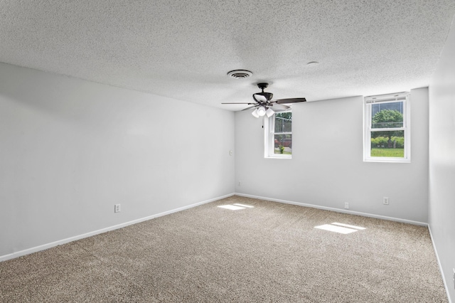 2125 White Bear Ave N, Maplewood, MN 55109 - carpeted empty room featuring baseboards, a ceiling fan, and a textured ceiling