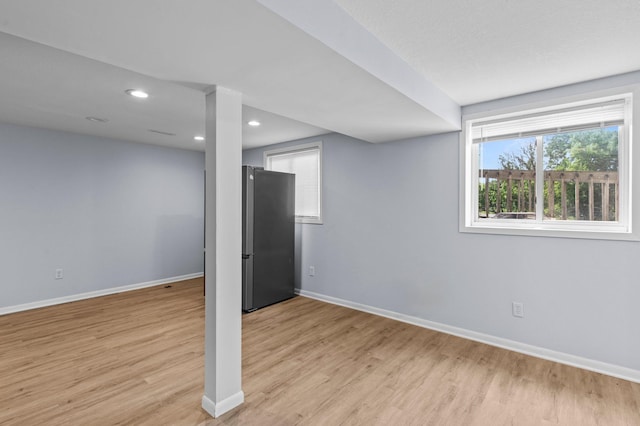 2125 White Bear Ave N, Maplewood, MN 55109 - below grade area featuring freestanding refrigerator, baseboards, light wood-type flooring, and recessed lighting