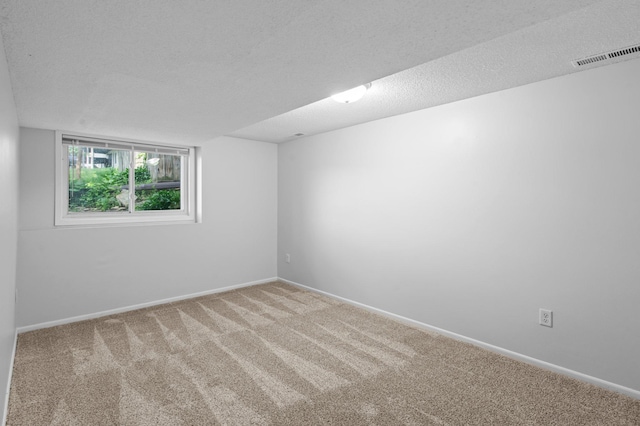2125 White Bear Ave N, Maplewood, MN 55109 - carpeted spare room with a textured ceiling and baseboards