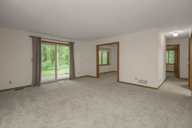 2 Crusader Ave E Unit A, West Saint Paul, MN 55118 - empty room with light colored carpet and a textured ceiling