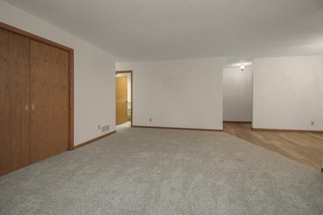 2 Crusader Ave E Unit A, West Saint Paul, MN 55118 - unfurnished room featuring carpet and a textured ceiling