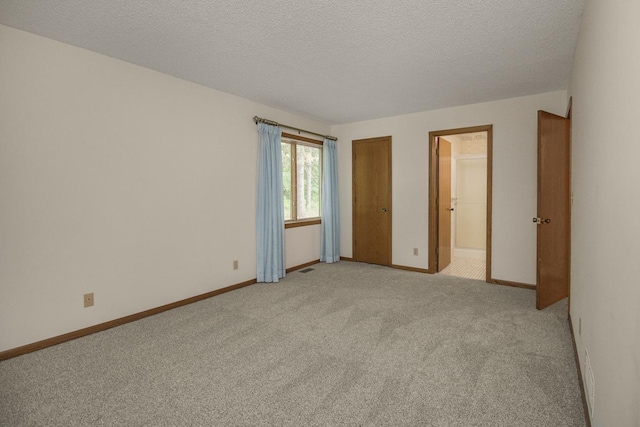 2 Crusader Ave E Unit A, West Saint Paul, MN 55118 - unfurnished room featuring light carpet and a textured ceiling