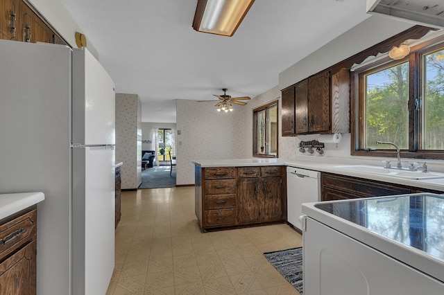 37875 600th Ave, Eden Valley, MN 55329 - kitchen featuring white appliances, light flooring, a peninsula, open floor plan, and a ceiling fan