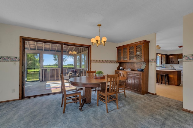 37875 600th Ave, Eden Valley, MN 55329 - carpeted dining area featuring plenty of natural light and a chandelier