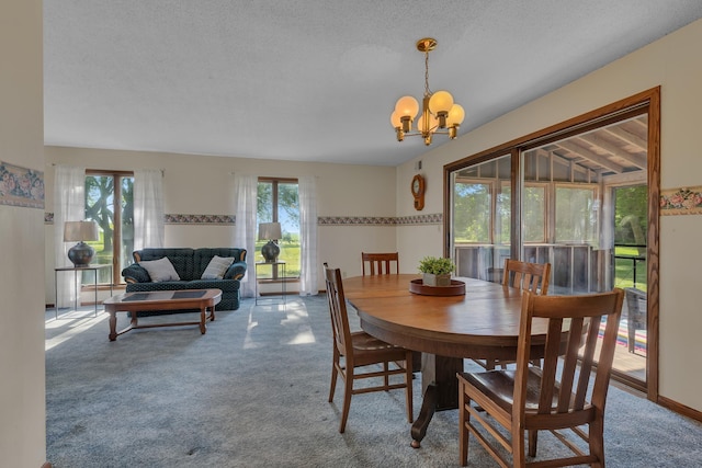 37875 600th Ave, Eden Valley, MN 55329 - dining area featuring plenty of natural light, a chandelier, carpet floors, and a textured ceiling