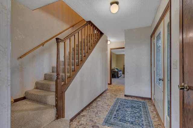 37875 600th Ave, Eden Valley, MN 55329 - entrance foyer with stairs and a textured ceiling