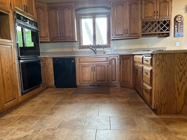 70 Lakeview Dr, Slayton, MN 56172 - kitchen with black appliances, a sink, and brown cabinets