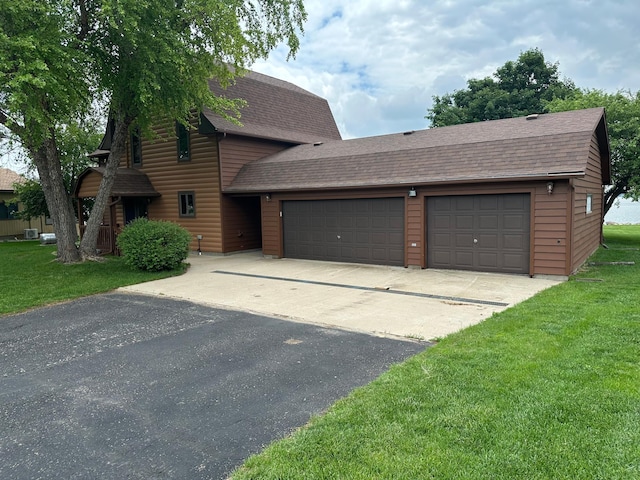 70 Lakeview Dr, Slayton, MN 56172 - dutch colonial featuring roof with shingles, a front lawn, asphalt driveway, and a garage