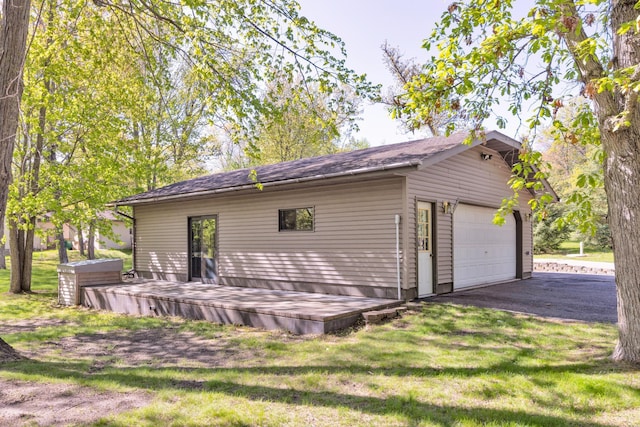 25397 Island View Dr, Cohasset, MN 55721 - back of property featuring a lawn, an outbuilding, and a deck