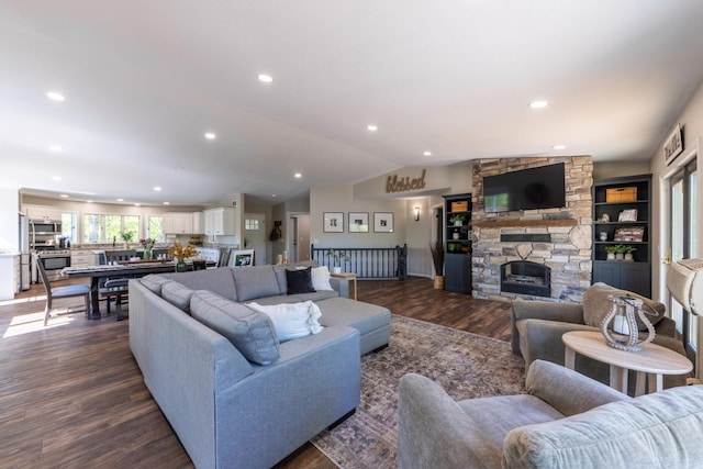 25397 Island View Dr, Cohasset, MN 55721 - living area featuring dark wood-type flooring, vaulted ceiling, recessed lighting, and a fireplace