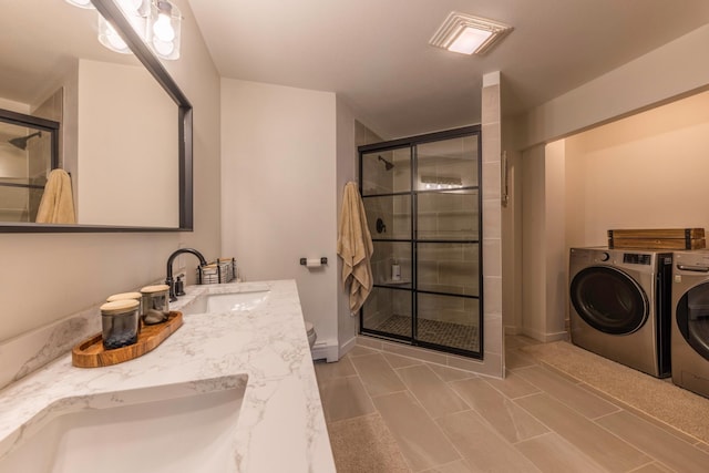 25397 Island View Dr, Cohasset, MN 55721 - bathroom featuring separate washer and dryer, a stall shower, double vanity, and toilet