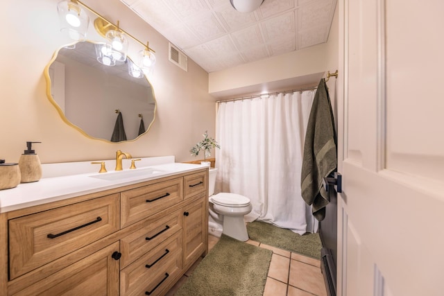25397 Island View Dr, Cohasset, MN 55721 - bathroom with vanity, toilet, baseboard heating, an ornate ceiling, and tile patterned flooring