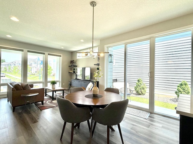 4848 161st St W, Lakeville, MN 55044 - dining area with a textured ceiling, wood finished floors, a chandelier, and recessed lighting