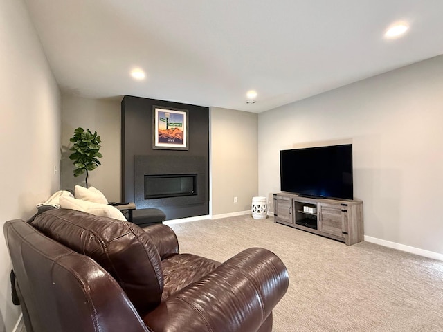 4848 161st St W, Lakeville, MN 55044 - carpeted living area featuring a glass covered fireplace, baseboards, and recessed lighting