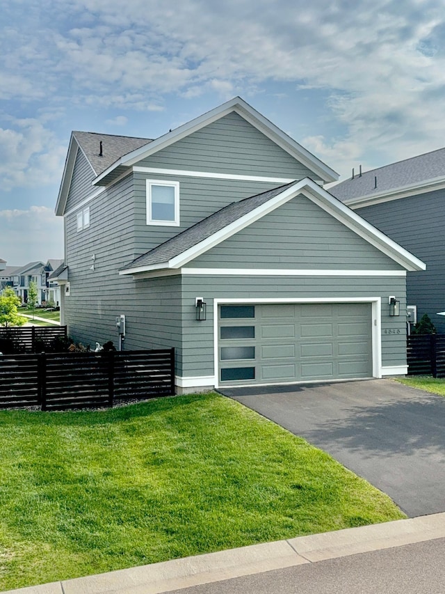 4848 161st St W, Lakeville, MN 55044 - view of front facade with asphalt driveway, a garage, and a shingled roof