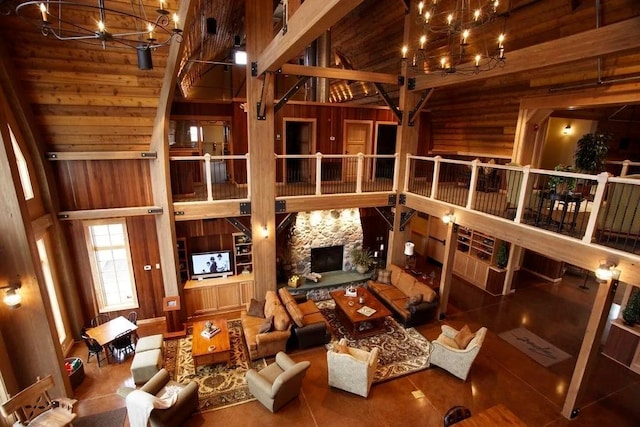 4848 161st St W, Lakeville, MN 55044 - living room with a chandelier, vaulted ceiling, a stone fireplace, and wooden walls
