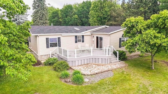505 Superior Ave, Crosby, MN 56441 - view of front facade with roof with shingles, a deck, and a front yard