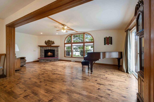 505 Superior Ave, Crosby, MN 56441 - living room featuring wood finished floors, ceiling fan, a fireplace, and recessed lighting