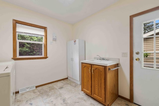 505 Superior Ave, Crosby, MN 56441 - laundry room with cabinet space, washer / clothes dryer, and healthy amount of natural light