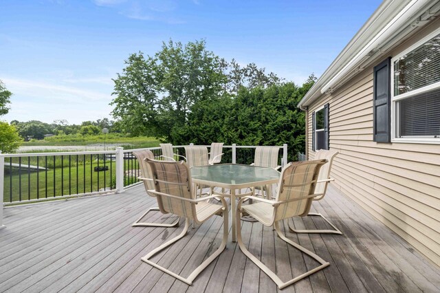 505 Superior Ave, Crosby, MN 56441 - wooden terrace with outdoor dining area and a lawn