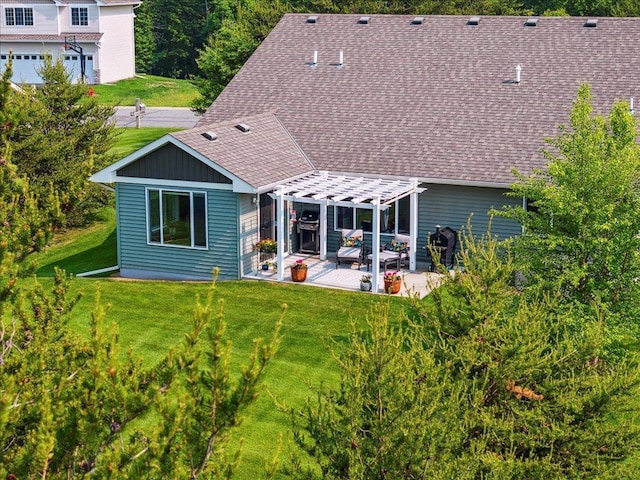 9308 Viking St, Brainerd, MN 56401 - back of house featuring a pergola, roof with shingles, a patio area, and a yard