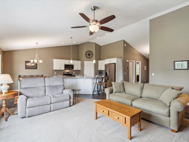 9308 Viking St, Brainerd, MN 56401 - living area featuring ceiling fan, carpet flooring, high vaulted ceiling, and a chandelier