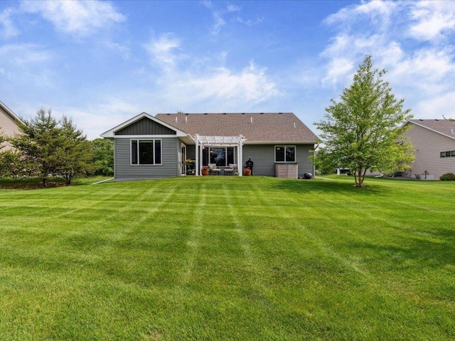 9308 Viking St, Brainerd, MN 56401 - rear view of property featuring a pergola, a lawn, and a patio