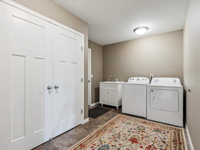 9308 Viking St, Brainerd, MN 56401 - washroom featuring washer and clothes dryer, cabinet space, and a textured ceiling