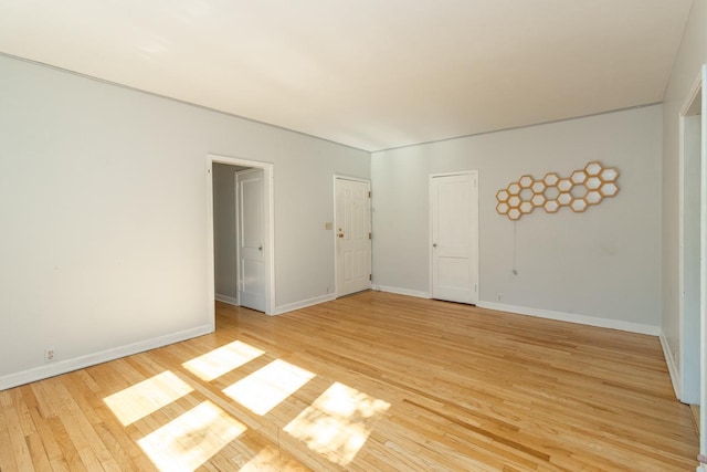 3128 Bde Maka Ska Blvd Unit 415, Minneapolis, MN 55416 - unfurnished room with light wood-style floors and baseboards