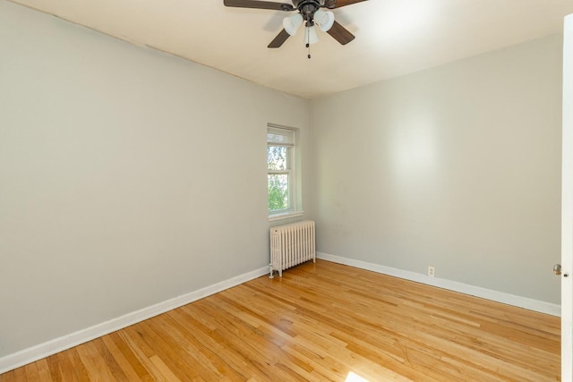 3128 Bde Maka Ska Blvd Unit 415, Minneapolis, MN 55416 - unfurnished room with radiator heating unit, a ceiling fan, baseboards, and light wood-style flooring