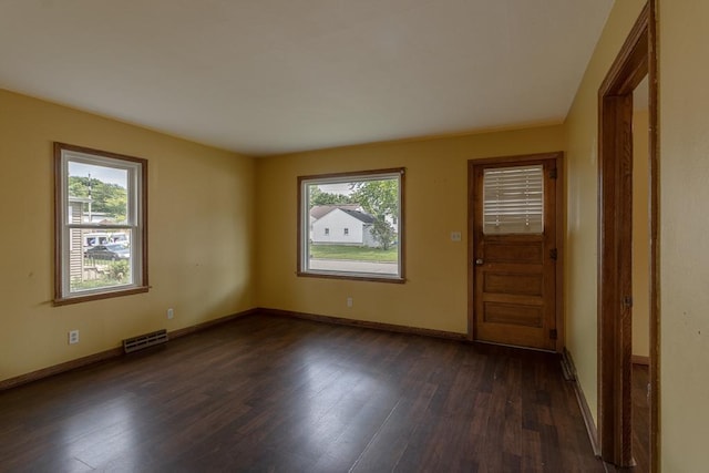 509 8th Ave SE, Waseca, MN 56093 - entrance foyer with plenty of natural light, dark wood-style flooring, and baseboards