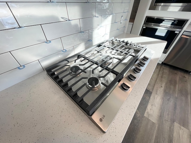 4818 163rd St N, Hugo, MN 55038 - kitchen view of stainless steel appliances, light countertops, and tasteful backsplash